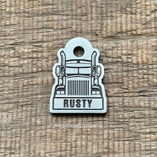 Load image into Gallery viewer, Personalised semi truck dog tag engraved with the name Rusty on brushed nickel silver, featuring a front-facing road train design.
