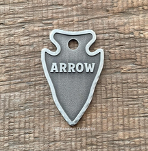 Load image into Gallery viewer, Dog ID tag shaped like a stone arrowhead with deep engraved textured design, personalised engraved metal pet tag with the name Arrow.