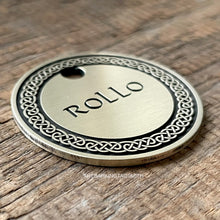 Load image into Gallery viewer, Dog ID tag with detailed Celtic knot border deep engraved on round metal tag, personalised engraved pet tag with the name Rollo