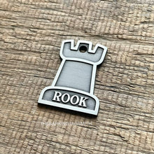 Load image into Gallery viewer, Dog ID tag shaped like a chess rook piece with the name Rook engraved, personalised deep engraved metal pet tag with a clean minimal design.