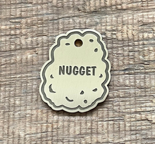 Load image into Gallery viewer, Dog ID tag shaped like a chicken nugget with engraved texture details and the name Nugget, personalised metal pet tag.