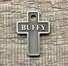 Load image into Gallery viewer, Dog ID tag shaped like a Christian cross with deep engraved metal design, personalised engraved pet tag with the name Buffy.