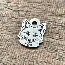 Load image into Gallery viewer, Dog ID tag shaped like a fox head with detailed deep engraved fox face design, personalised engraved metal pet tag for wildlife and nature lovers.