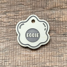 Load image into Gallery viewer, Dog ID tag shaped like a fried egg with engraved name Eggie, personalised deep engraved metal pet tag for dogs and cats.