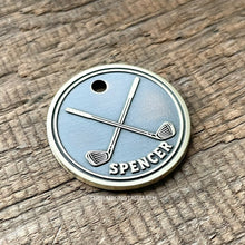 Load image into Gallery viewer, Dog ID tag with crossed golf clubs deep engraved on round metal tag, personalised engraved pet tag for golf lovers with the name Spencer.
