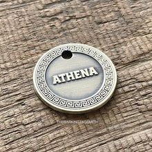 Load image into Gallery viewer, Dog ID tag with Greek key border and engraved name Athena, personalised deep engraved metal pet tag for dogs and cats.