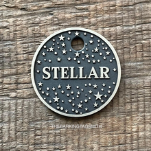 Load image into Gallery viewer, Dog ID tag with starry night sky pattern deep engraved on round metal tag, personalised engraved pet tag with the name Stellar.