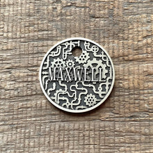 Load image into Gallery viewer, Dog ID tag with steampunk gear design and engraved name Maxwell, personalised deep engraved metal pet tag with mechanical industrial pattern.