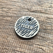Load image into Gallery viewer, Personalised tiger stripe dog ID tag with engraved tiger fur pattern and raised Tiger name in brushed silver metal on rustic wood background