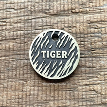 Load image into Gallery viewer, Personalised tiger stripe dog ID tag with engraved tiger fur pattern and raised Tiger name in brushed silver metal on rustic wood background