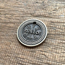 Load image into Gallery viewer, Personalised Viking compass dog ID tag with engraved Vegvisir Norse symbol and Celtic knot border in brushed silver metal on rustic wood background