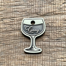 Load image into Gallery viewer, Dog ID tag shaped like a wine glass with the name Ginny engraved, personalised metal pet tag with deep engraving on brushed brass finish.